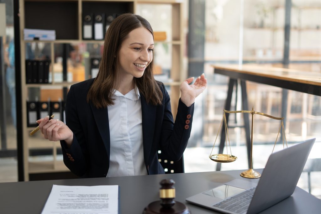 Woman lawyer working on a laptop. Legal law, advice and justice concept