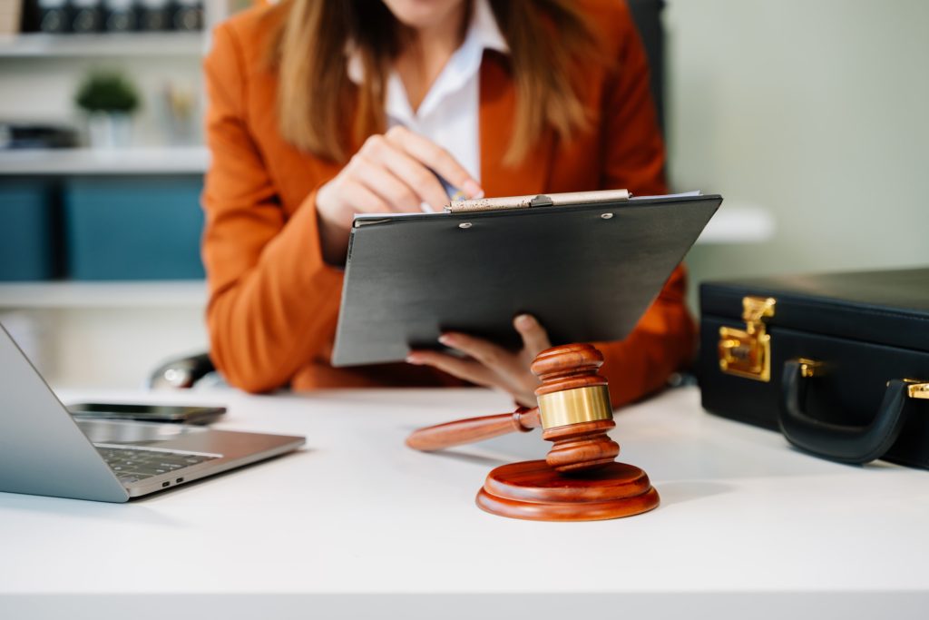 justice and law concept. Male judge in a courtroom the gavel, working